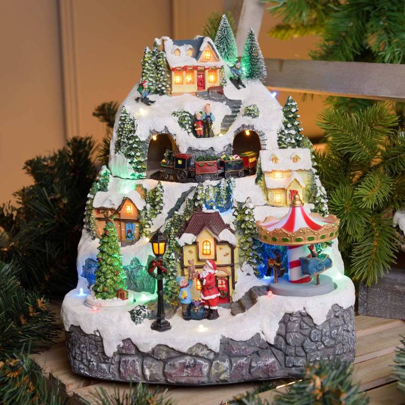 Village de Noel animé à LED avec montagne Enneigé Petit Train Sapin de Noël et Père Noël H31cm